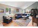 Comfortable living room with high ceilings, two windows, stylish decor and lots of natural light at 8997 W 88Th Ave, Westminster, CO 80021