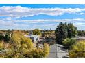 Aerial view showcasing surrounding neighborhood and city skyline at 1412 Pierce St, Lakewood, CO 80214