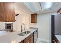 Galley kitchen features stainless steel appliances and stone countertops at 4281 S Salida Way # 8, Aurora, CO 80013