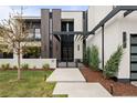 Contemporary home with clean lines, a gated entryway, and sleek modern lighting fixtures at 2821 E Cedar Ave # 17, Denver, CO 80209