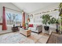 Comfortable living room showcasing large window, area rug, and stylish decor at 5237 W 100Th Ct, Westminster, CO 80020