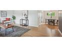 Bright living space with hardwood flooring, neutral walls, and stylish decor at 8490 E Davies Pl, Centennial, CO 80112