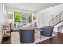 Well-lit living area featuring modern decor, stylish furnishings, and natural light at 1511 S Pennsylvania St, Denver, CO 80210