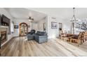 Spacious living and dining area boasting hardwood floors, neutral tones, and ample space for gatherings at 10121 Wyandott Cir, Thornton, CO 80260