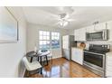 Bright dining area with a round table, modern chairs, and natural light at 5735 W Atlantic Pl # 101, Lakewood, CO 80227