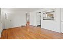 Inviting living room featuring gleaming hardwood floors and bright natural light at 2540 W Gunnison Dr, Denver, CO 80219