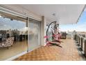 Spacious balcony with hanging lounge chairs, barbecue, and large sliding glass door for indoor/outdoor living at 800 N Washington St # 710, Denver, CO 80203