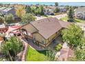 Aerial view of the house showing the backyard patio, landscaping, and surrounding neighborhood at 21863 E Oxford Pl, Aurora, CO 80018