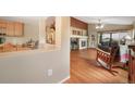 Inviting living room with hardwood floors, fireplace, and ample natural light at 21863 E Oxford Pl, Aurora, CO 80018