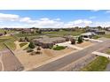 Serene community with large homes, white picket fences, and a home with a three-car garage and private yard at 12590 Valentia St, Thornton, CO 80602