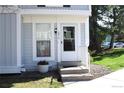 Inviting townhome with manicured lawn, bright windows and a charming entrance at 10515 W Dartmouth Ave, Lakewood, CO 80227