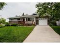 Charming single-story home with brick accents, attached garage, and well-maintained lawn at 1312 Sandstone Ct, Boulder, CO 80305