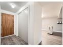 Bright entryway with wood door and closet at 1612 Cottonwood Dr # 2W, Louisville, CO 80027