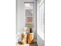 Stylish interior decor featuring wood stump side tables, houseplants, and natural light at 1457 Yates St, Denver, CO 80204