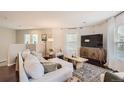 Living room with hardwood floors, neutral decor, and comfy seating at 12832 Mayfair Way # F, Englewood, CO 80112