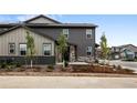 Well-maintained two-story home with neutral color scheme and attractive landscaping at 9756 Mount Kataka Pt, Littleton, CO 80125