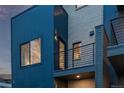 Striking home exterior with mixed siding, a private balcony and views from the large picture window at 535 Josephine St, Denver, CO 80206