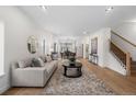 Bright and airy living room with hardwood floors, a decorative rug, and an open layout with modern finishes at 535 Josephine St, Denver, CO 80206