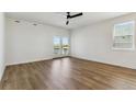 Spacious main bedroom with a ceiling fan, private balcony, and natural light at 42976 Colonial Trl, Elizabeth, CO 80107