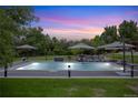 Inviting pool area with plenty of lounge space at 6200 Charrington Dr, Cherry Hills Village, CO 80111