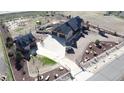 Expansive property showcasing a spacious driveway, meticulously landscaped grounds, and guest house alongside the main residence at 15280 Bannock St, Broomfield, CO 80023
