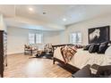 Spacious bedroom features stylish decor, light hardwood floors, and plenty of natural light at 15280 Bannock St, Broomfield, CO 80023