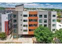 A modern apartment building with parking and secure entry features various textures and balcony views at 2729 W 28Th Ave # 401, Denver, CO 80211