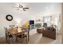 Cozy living area with a fireplace, dining table, and comfortable seating at 31819 Rocky Village Dr # 208, Evergreen, CO 80439