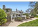Townhome featuring a fenced front yard, mature landscaping and sidewalk at 494 Owl Dr # 4, Louisville, CO 80027