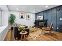 Comfortable living room with a fireplace and plenty of natural light, ideal for Gathering gatherings at 6885 E Briarwood Cir, Centennial, CO 80112