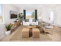Cozy living area with comfortable seating, stylish decor, and a large window at 21104 E 63Rd Dr, Aurora, CO 80019