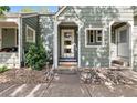 Welcoming entryway with a stylish front door, and professionally landscaped yard at 2059 S Balsam St, Lakewood, CO 80227