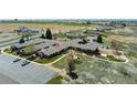 Scenic aerial view of community showcases landscaping, road access, and convenient parking at 5425 County Road 32 # 14, Mead, CO 80504