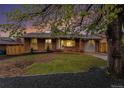 Charming brick home featuring a well-maintained lawn and inviting front entrance at 380 S Xanadu St, Aurora, CO 80012