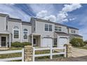 Charming townhome featuring an attached garage and lovely landscaping at 12332 Colorado Blvd # 30, Thornton, CO 80241