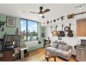 Cozy living room with hardwood floors, large windows with city views, and unique decor at 603 Inca St # 520, Denver, CO 80204
