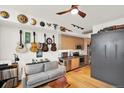 Stylish living room with hardwood floors, a comfortable sofa, stainless appliances and modern kitchen at 603 Inca St # 520, Denver, CO 80204
