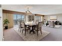 Elegant dining area with stylish decor and natural light, part of an open-concept living space at 13631 E Marina Dr # 608, Aurora, CO 80014