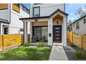 Charming exterior showcasing a modern home with a covered porch and well-maintained landscaping at 1578 Lowell Blvd # 1, Denver, CO 80204