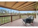 Relaxing covered deck with comfortable seating and a serene outdoor view, perfect for enjoying the scenery at 4212 E Orchard Pl, Centennial, CO 80121