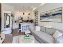 Inviting living room flows into a modern kitchen, creating an open and airy living space at 1472 Yates St, Denver, CO 80204