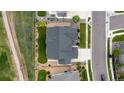 Aerial view of a well-maintained home, showcasing the roof, lawn, landscaping, and neighborhood at 11259 Kalispell St, Commerce City, CO 80022