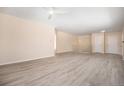 Spacious living room featuring light gray vinyl flooring at 1832 Simms St, Lakewood, CO 80215