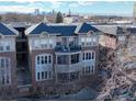 Attractive multi-story home with a charming balcony and scenic city views in the distance at 1489 Steele St # 310, Denver, CO 80206