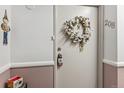 Apartment entryway with a decorative wreath and a seasonal decoration at 13606 E Bates Ave # 208, Aurora, CO 80014
