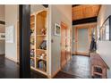 Warm entryway with wood accents, slate flooring, and built-in shelving, creating a cozy and inviting welcome at 116 Ramona Rd, Golden, CO 80403