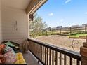 Charming front porch featuring comfortable seating and scenic neighborhood views at 1344 Royal Troon Dr, Castle Rock, CO 80104