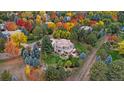 Luxury home nestled among colorful autumn trees. Large yard at 5320 S Race Ct, Greenwood Village, CO 80121