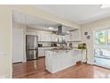 Bright kitchen with granite countertops, stainless appliances and island at 5512 S Greenwood St, Littleton, CO 80120
