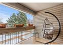 Relaxing patio area with porch swing and scenic views of the outdoors at 5512 S Greenwood St, Littleton, CO 80120